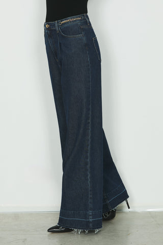 Jeans REECE vita alta 5ts con fondo sfrangiato più catena logo in blue denim